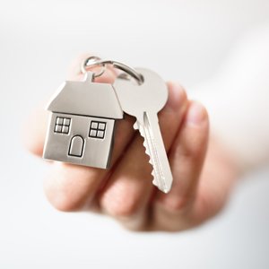 A landlord holding the keys to a rental property